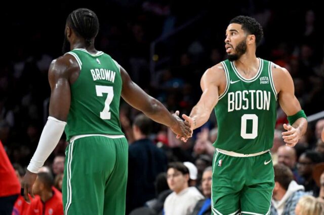 Jayson Tatum #0 of the Boston Celtics celebrates with Jaylen Brown #7 in the third quarter against the Washington Wizards at Capital One Arena on October 30, 2023 in Washington, DC.