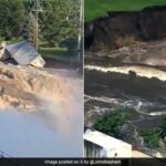 Vídeos dramáticos mostram água furiosa fluindo ao redor da barragem dos EUA enquanto varre prédios