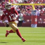 SANTA CLARA, CALIFÓRNIA - 29 DE SETEMBRO: Brock Purdy # 13 do San Francisco 49ers corre com a bola no primeiro quarto contra o New England Patriots no Levi's Stadium em 29 de setembro de 2024 em Santa Clara, Califórnia.